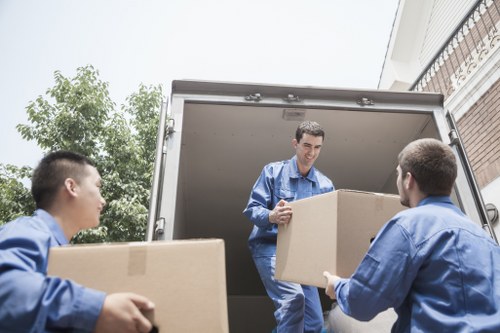 Local removals van loading household items near Parsons Green