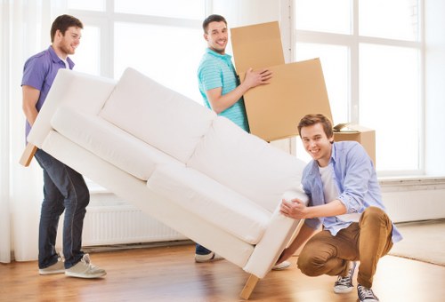 Professional moving team handling furniture transport in Parsons Green