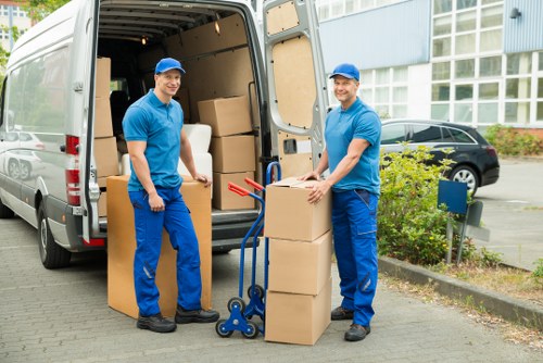 Careful loading of household items into a van in Parsons Green