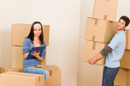 Piano movers planning access on a Parsons Green street